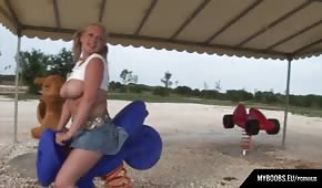 Busty and round chick on a motorcycle